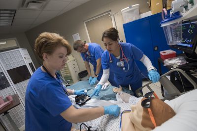 Nursing Students in training exercise with mannequin
