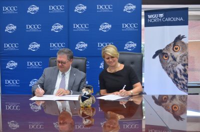 To DCCC Newsroom: President Signs WGU Agreement