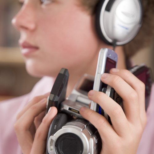 young individual holding compact camcorder