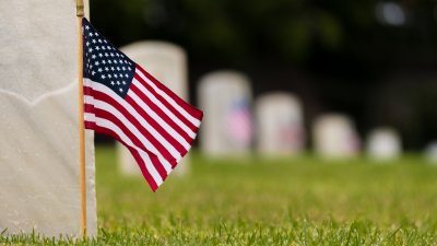 Small American flag in veteran cemetery