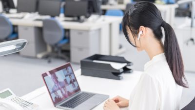person at desk on video call