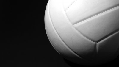 White Volleyball up close on black background