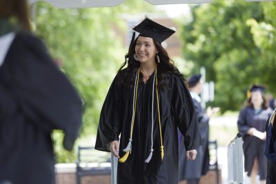 Davidson-Davie Graduate in Cap and Gown crosses Stage