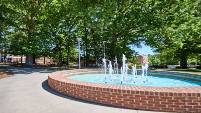 Fountain with brick wall in the middle of Davidson-Davie Community College courtyard