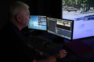 Law Enforcement Instructor operates law enforcement simulator