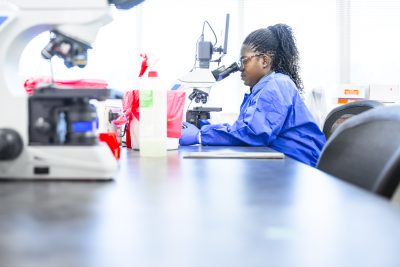 Medical Laboratory Technology Student uses microscope