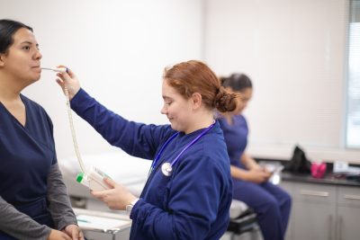 Medical Assisting students check vitals