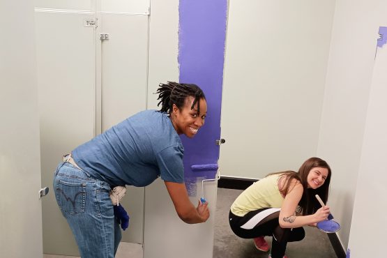 Demetria Nickens and Casey Williams who volunteered to paint bathrooms at Salvation Army Boys & Girls Club of Thomasville.